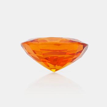 1228. A 7.98 ct yellow-orange sapphire.