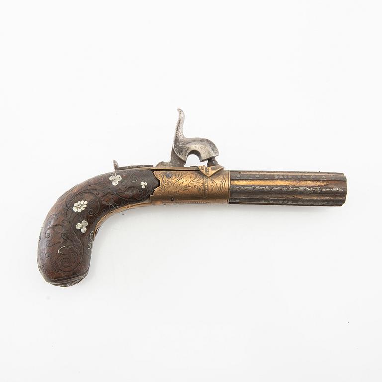 A British percussion pistol, 19th century.
