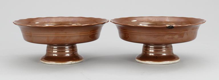 A pair of cappuciner glazed tazzas, China, with Qianlong seal mark.