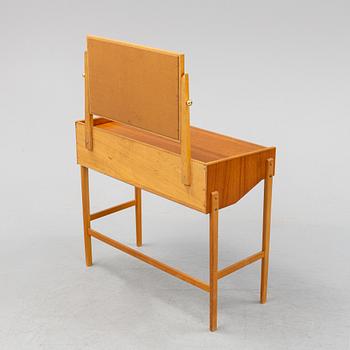 A teak make-up table from the second half of the 20th-century.