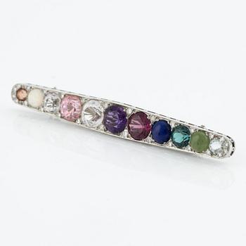 Brooch, platinum with gemstones and diamonds.