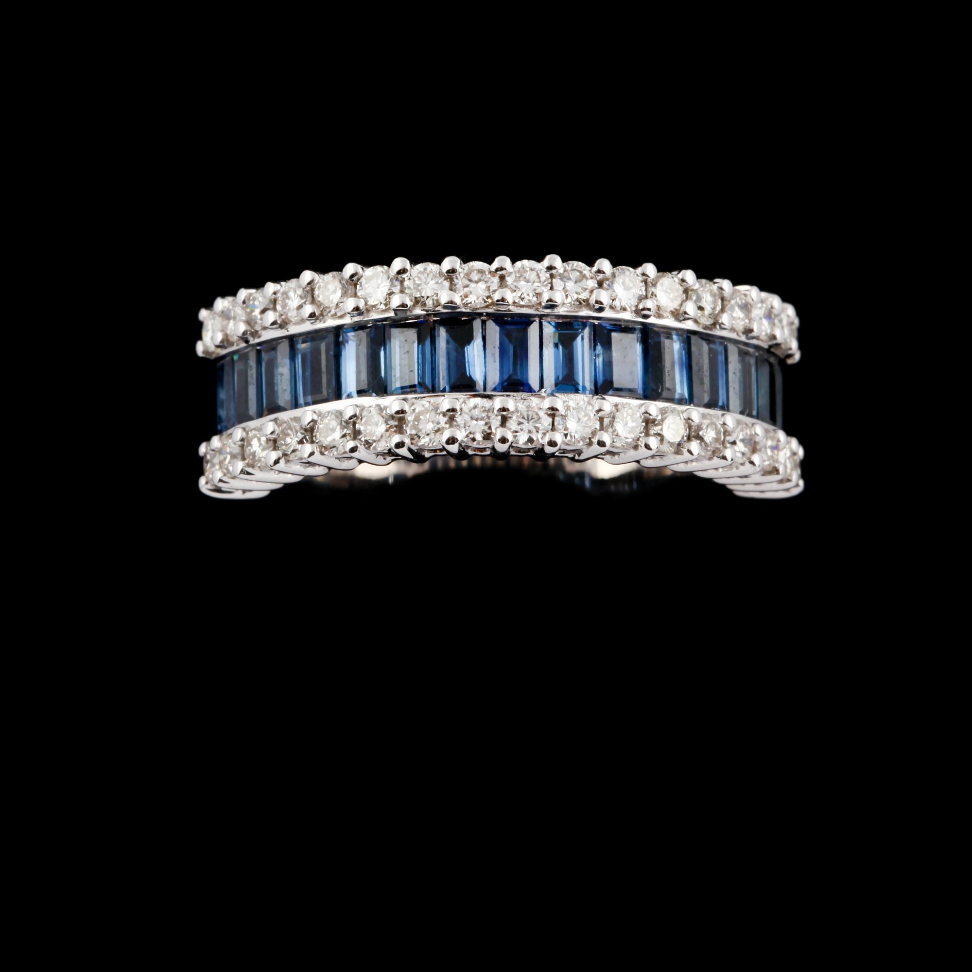 RING, 18k vitguld med 34 briljantslipade diamanter, ca 0.64 ct samt 15 blå safirer, ca 1.54 ct. Vikt 7 g.