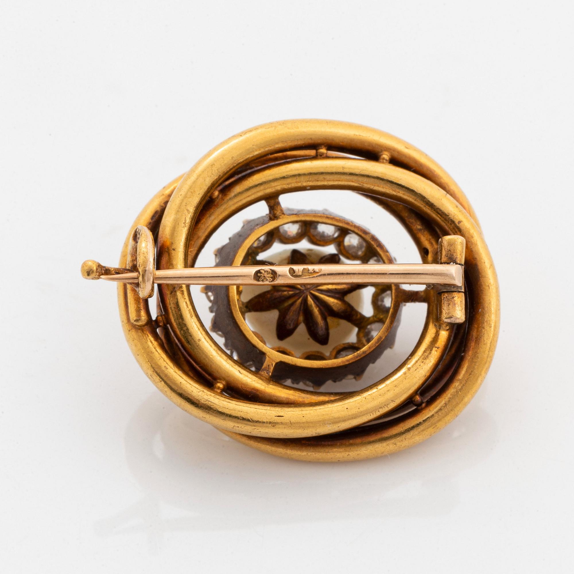 A 14K gold brooch set with a pearl and old-cut diamonds.