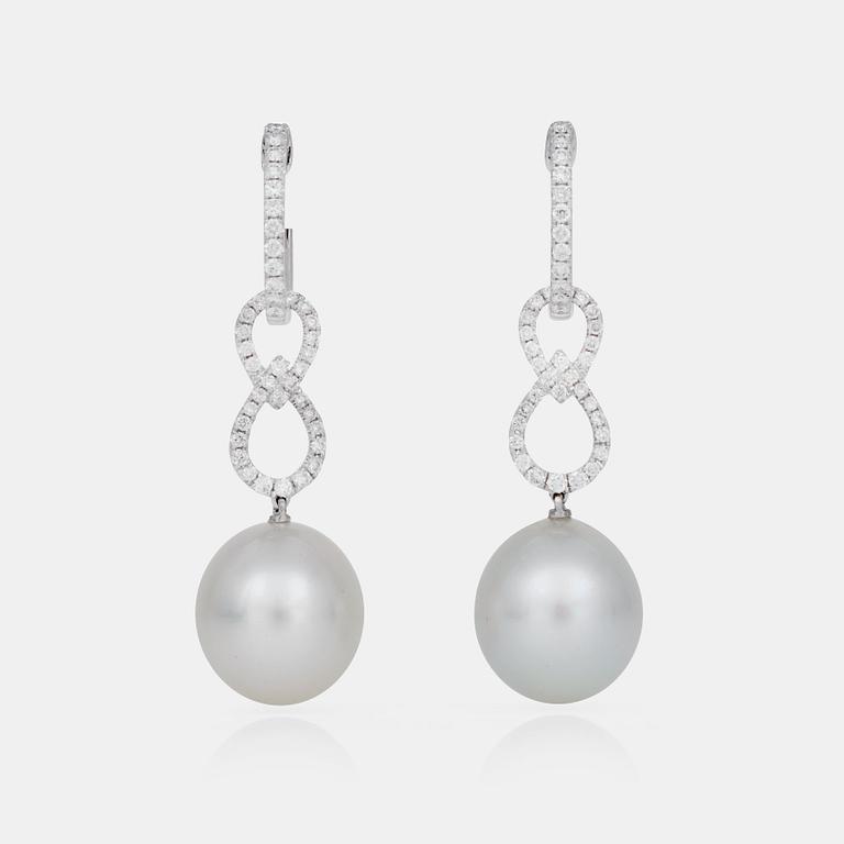 A pair of cultured South Sea pearl and brilliant-cut diamond earrings.