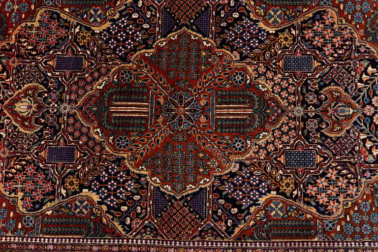 A rug, semi-antique Kashan, ca 216,5 x 140 cm.