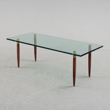 A 1960's glass sofa table.