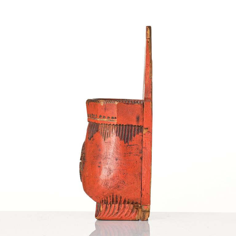 A Swedish folk art carved and painted spoon holder, 18th century.