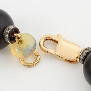 Necklace, 18K gold with onyx, opal, and diamonds.