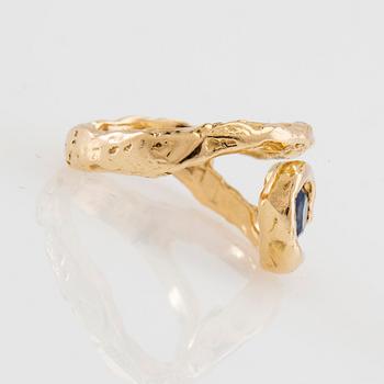 Nadia Shelbaya, Ring "L´oeil D´horus" 18K gold with a faceted sapphire.