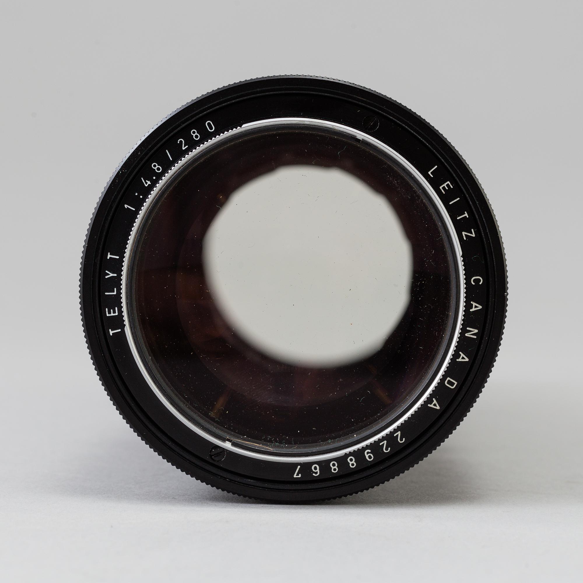 A black Leica Telyt 1:4,8/280 lens no 2298867, Leitz Canada.