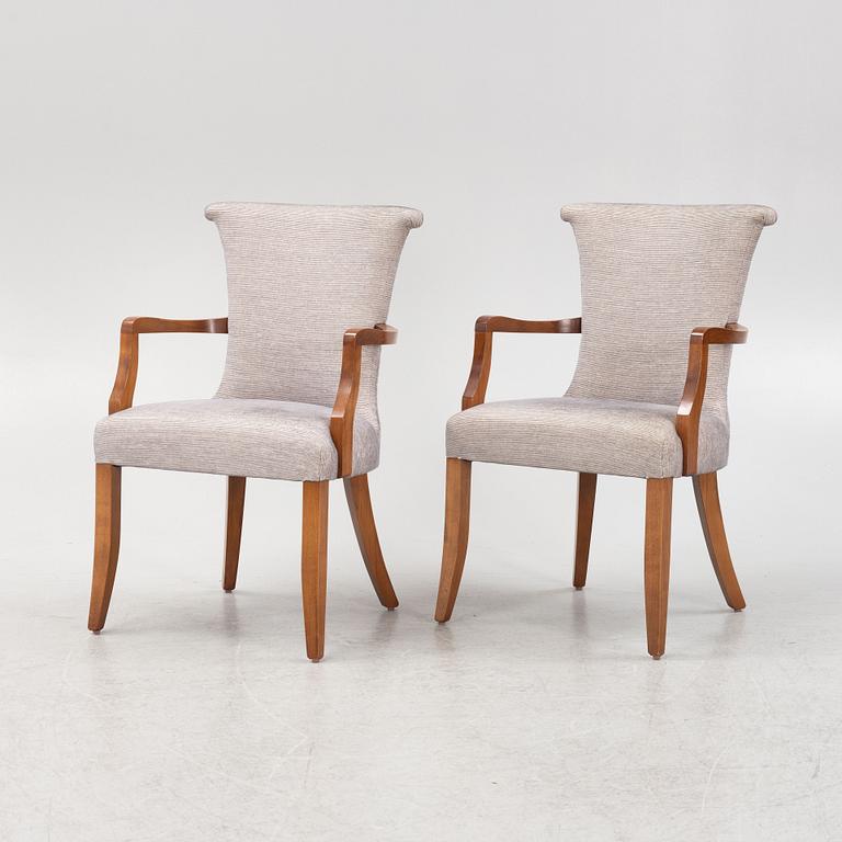 A pair of stained beech armchairs, 20th Century.