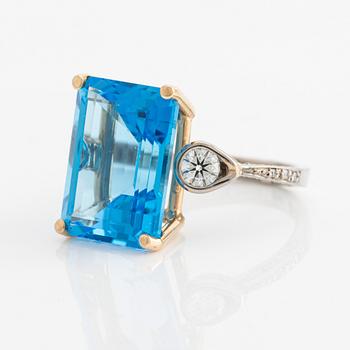 Ring, cocktail ring with large blue topaz and brilliant-cut diamonds.