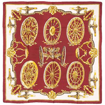 Hermès, a 'Roues de Canon' silk scarf.