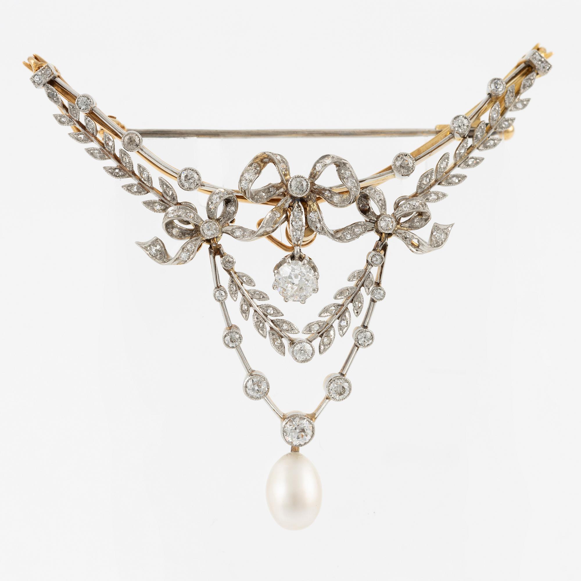 Brooch, gold and platinum, in the form of a bow and garlands with diamonds and a pearl.