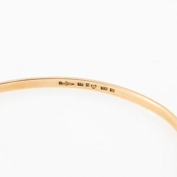 Wiwen Nilsson, Armring 18K gold with a synthetic white spinel, Lund 1967.