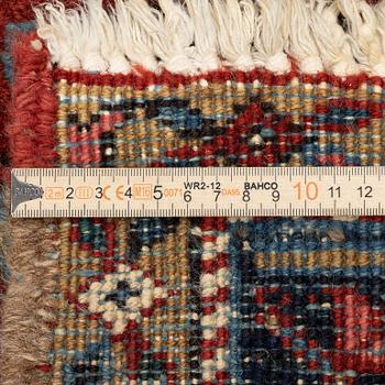 A semi-antique Heris carpet, west persia c. 322 x 252 cm.