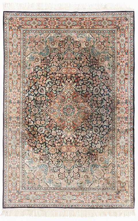 An oriental carpet, mercerized cotton, c. 275 x 182 cm.