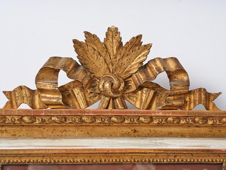 A pair of late Gustavian giltwood and gouache-inset mirrors, Stockholm, late 18th century.