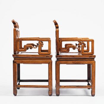 A pair of hardwood armchairs, late Qing dynasty.