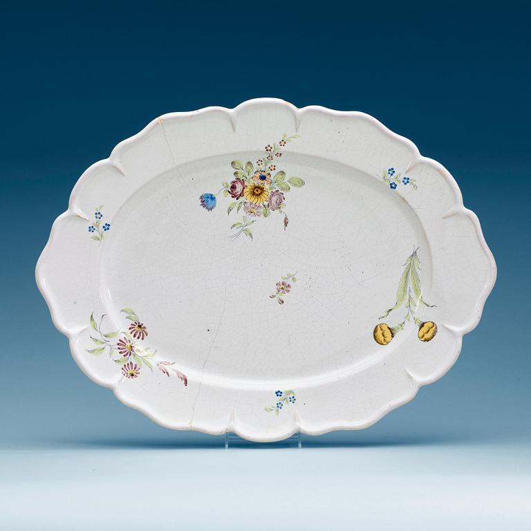 A Swedish Rörstrand faience charger, dated 11/1 (17)73.