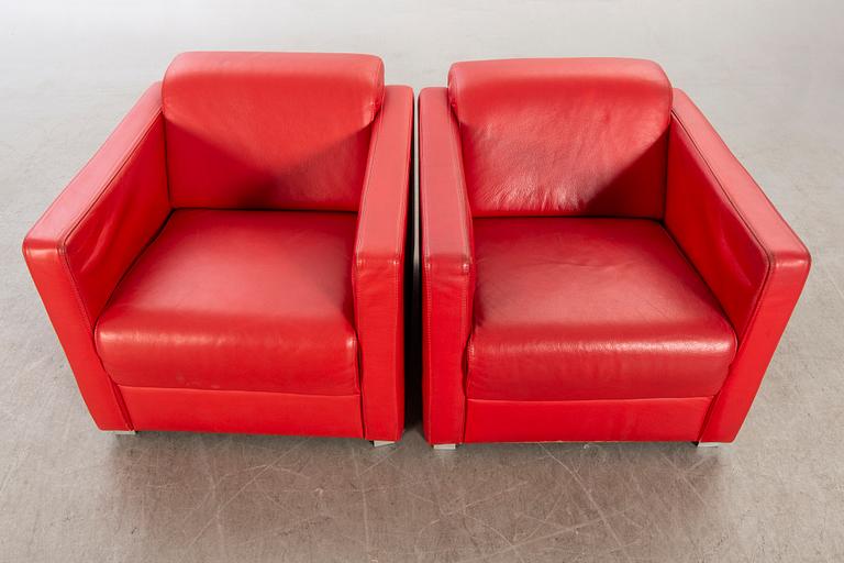 A pair of Italian 1990's leather armchairs.
