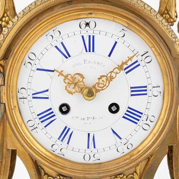 A Louis XVI-style gilt bronze mantel clock, 19th Century.