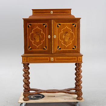 A Baroque style cabinet, circa 1900.