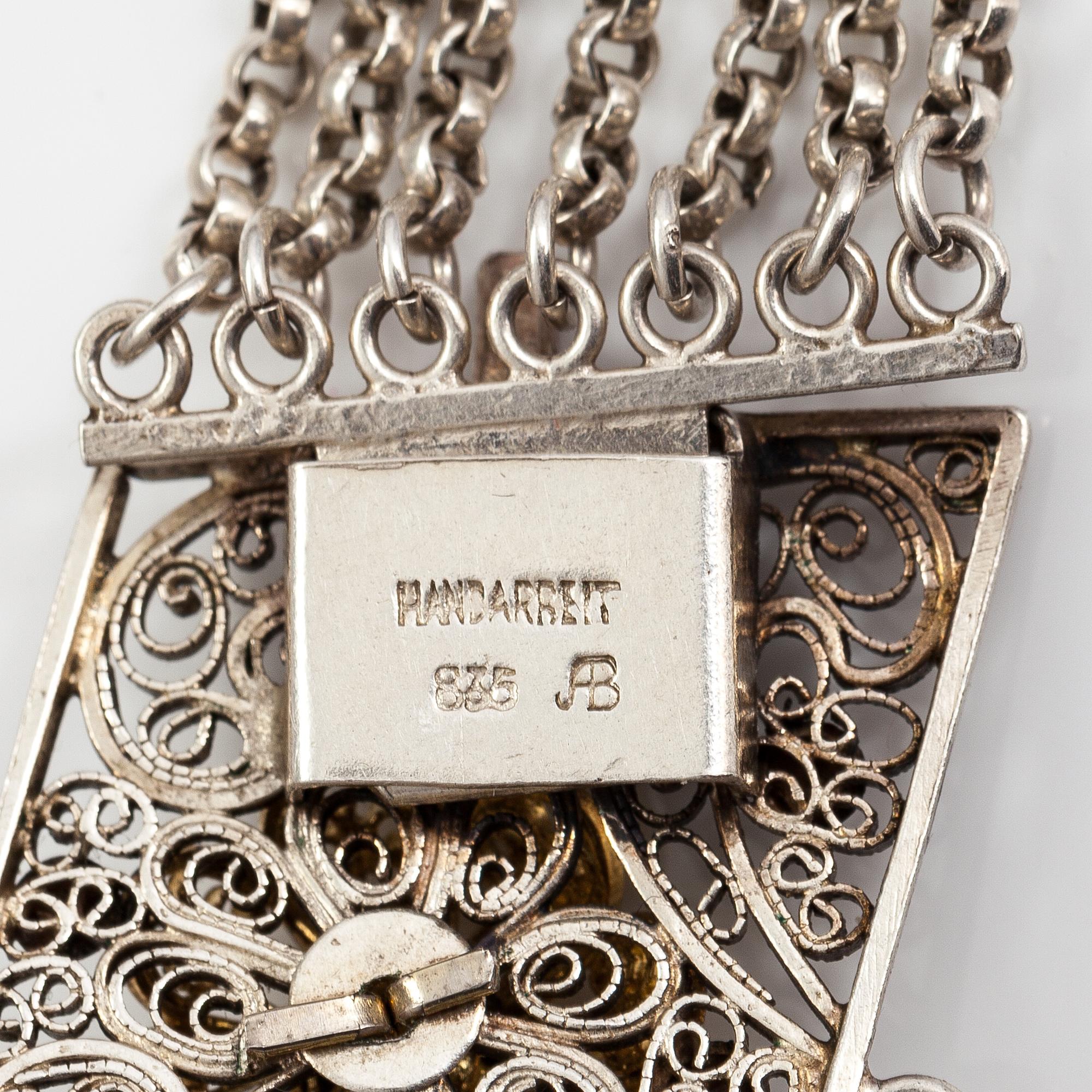 A silver necklace.