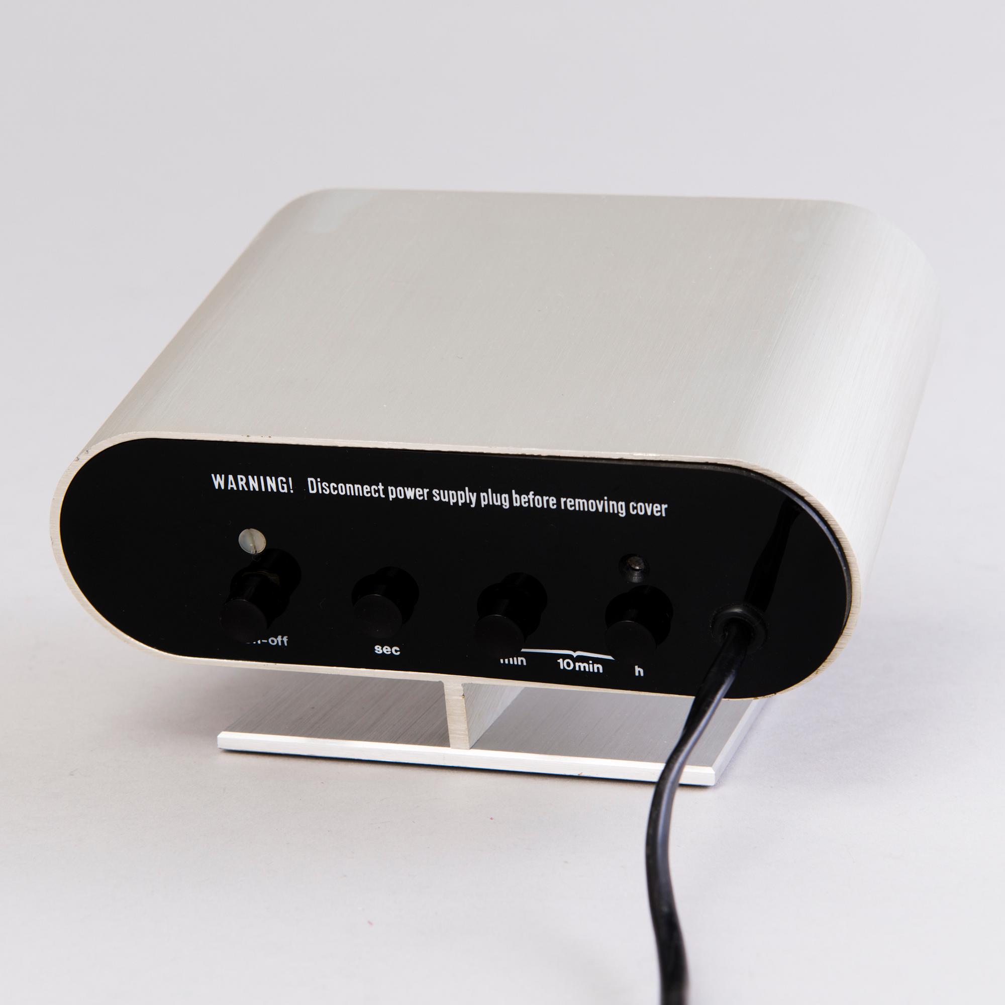 A 1970s digital Quartz TAG HEUER desk clock, brushed aluminium.