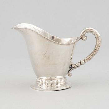 A silver coffee pot, creamer and sugar bowl, CG Hallberg Stockholm 1932-39.