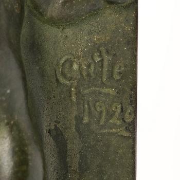 Axel Gute, a pair of green patinated metal bookends, Sweden, dated 1920.