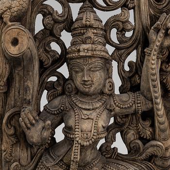 A carved wooden Shiva, India, around the year 1900.