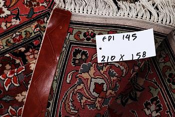 A rug, Tabriz, part silk, 50 Raj, ca 210 x 158 cm.