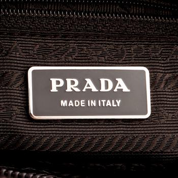 PRADA, a brown nylon crossbody bag.