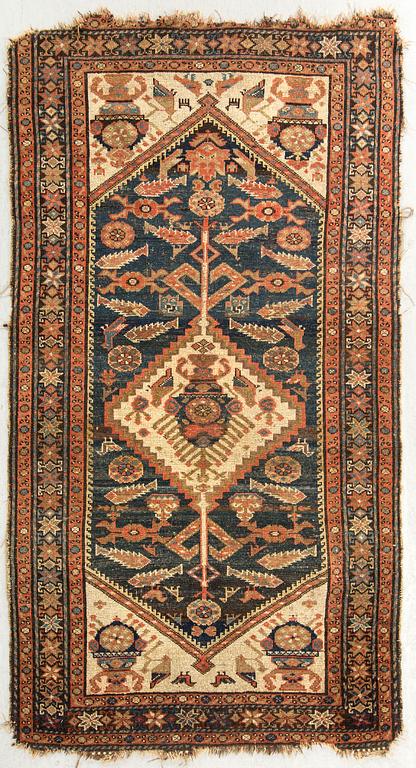 A probably later part of the 19th century Kurd carpet ca 190 x 116 cm.