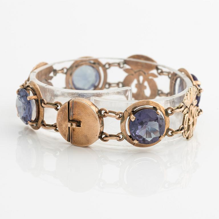 Bracelet and ring with color-changing synthetic stones.