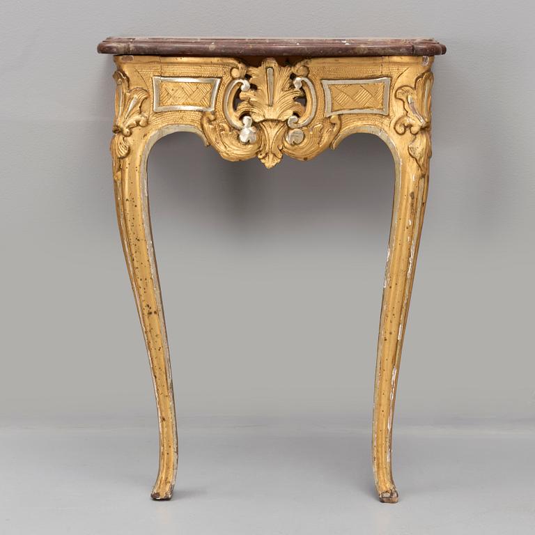 A rococo console table with a stone top, second half of the 18th century.
