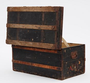A late 19th century black trunk by Louis Vuitton.