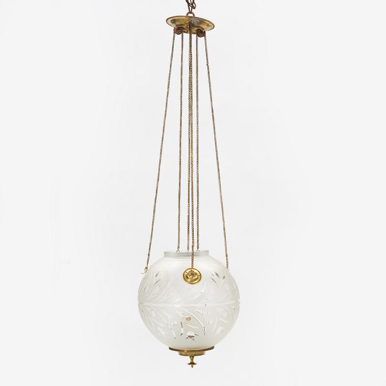 A brass and glass paraffin lamp, early 20th Century.