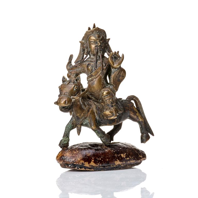 A group of three bronze miniatures sculptures of deities, China and Tibet, 18th Century.