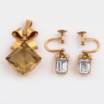 A citrine pendant and a pair of synthetic spinell earrings.