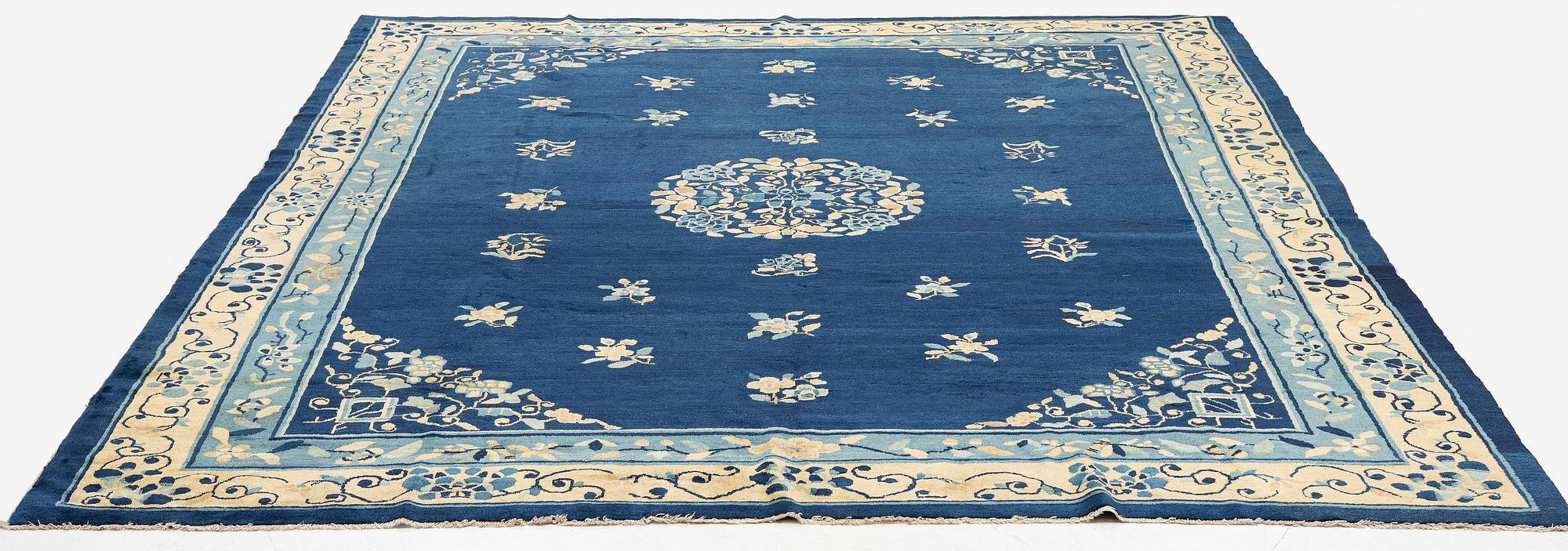An antique Peking (Beijing) carpet, North China, c. 340 x 275 cm.