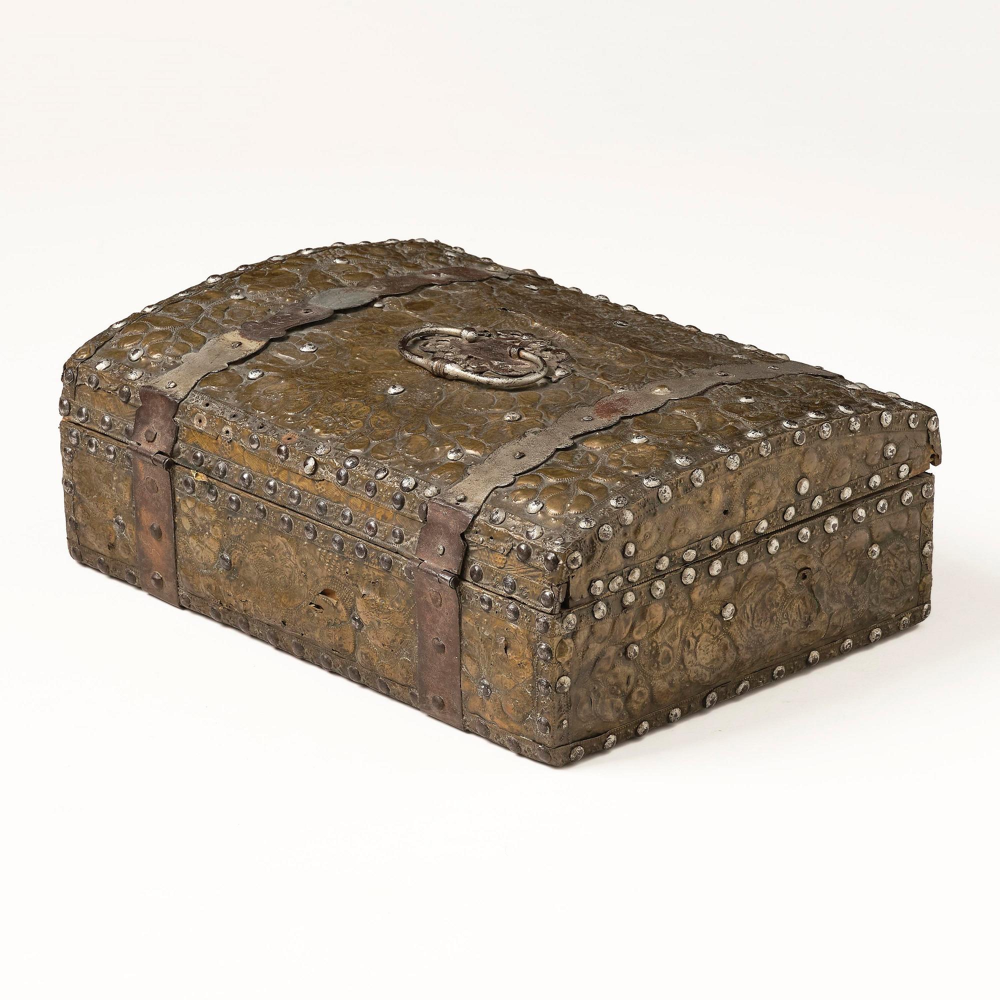 A presumably German baroque repoussé brass writing box, late 17th century.