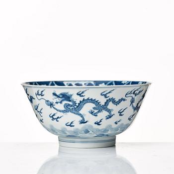 854. A blue and white four clawed dragon bowl, Qing dynasty, with Kangxis six character mark and period.