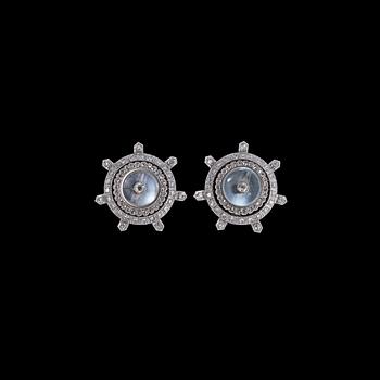 1277. A pair od moon stone and diamond earclips.