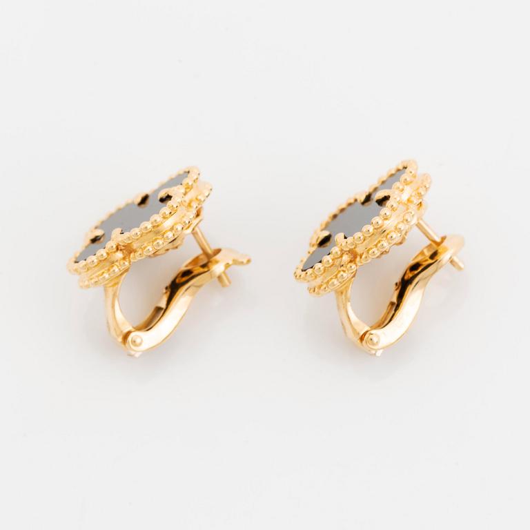 A pair of Van Cleef & Arpels "Alhambra" earrings in 18K gold and onyx.