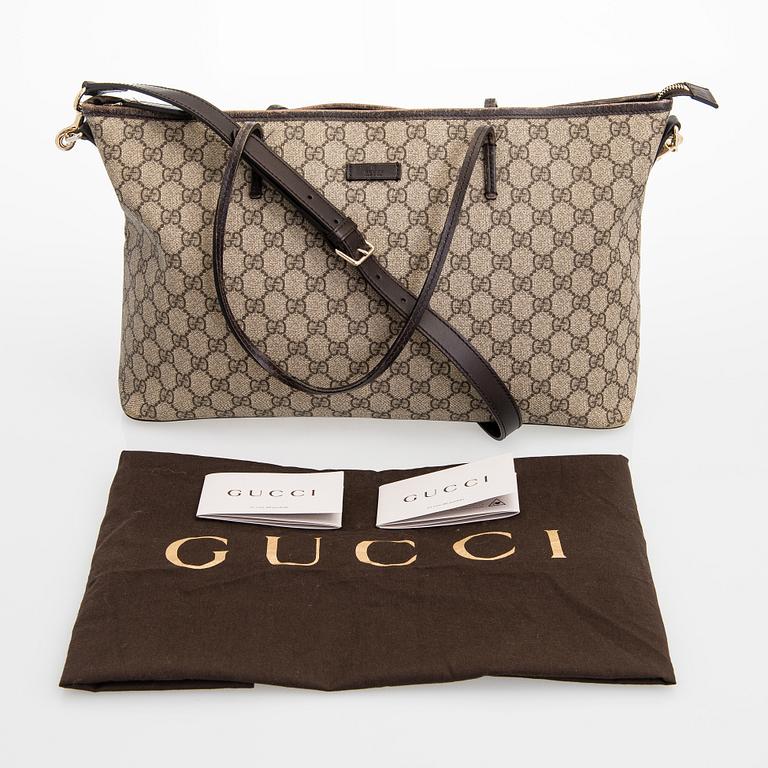 Gucci, a canvas tote bag.