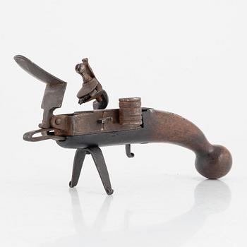 A 18th Century Flintlock lighter.