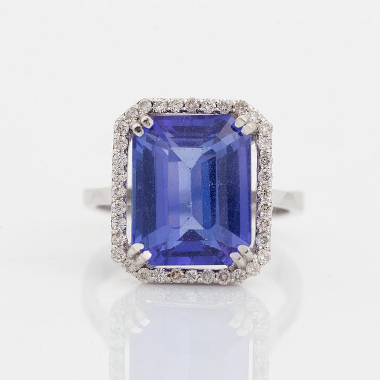 Emerald cut tanzanite and brilliant cut diamond cocktail ring.