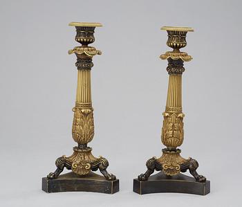 A pair of French 19th century bronze candlesticks.